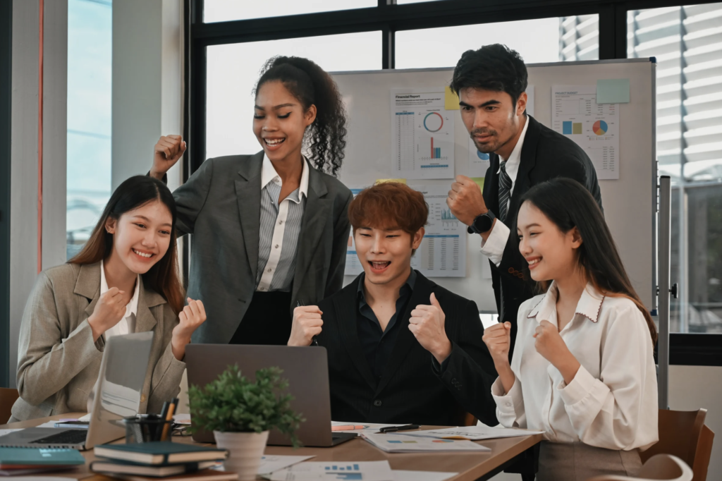 Team celebrating growth success after campaign